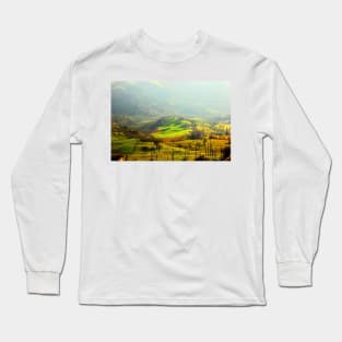 Hilly landscape partly covered with fog on a sunny day Long Sleeve T-Shirt